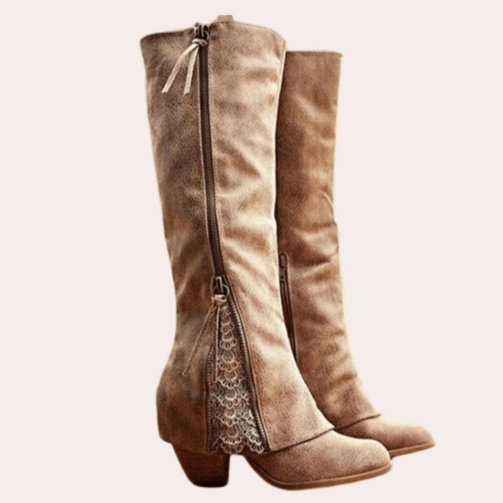 Pair of tan knee high riding boots with side zip, lace panel and block heel