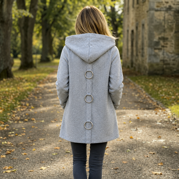 Back view of a grey longline hooded cardigan jacket with three metal ring details