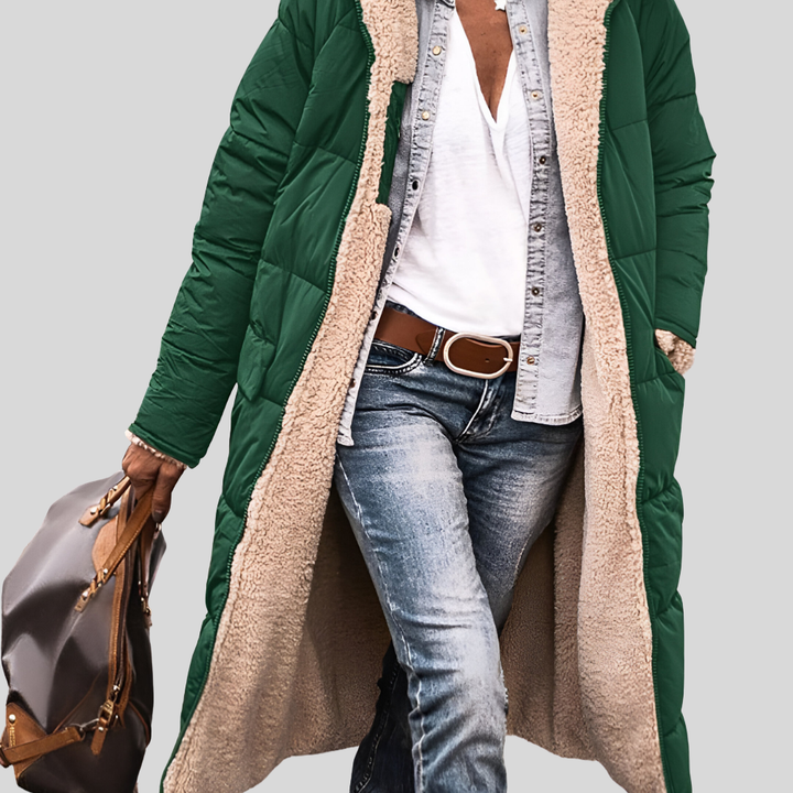 Dark green longline quilted coat with cream sherpa lining, worn open over jeans