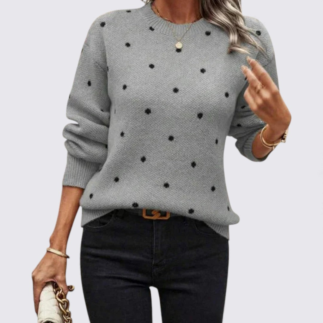 Gray crew neck sweater with black polka dots, worn with black jeans
