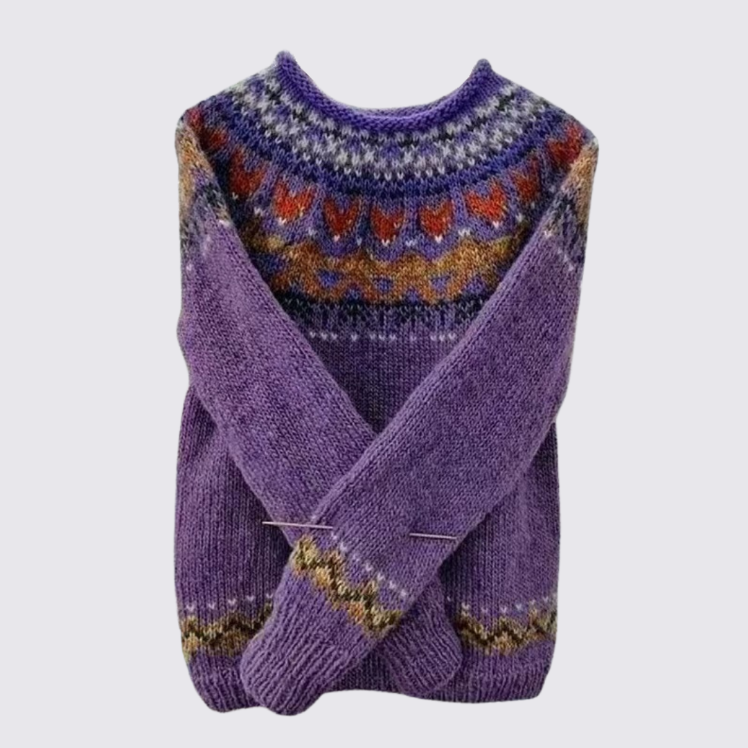 Purple Fair Isle sweater with a patterned yoke, folded flat