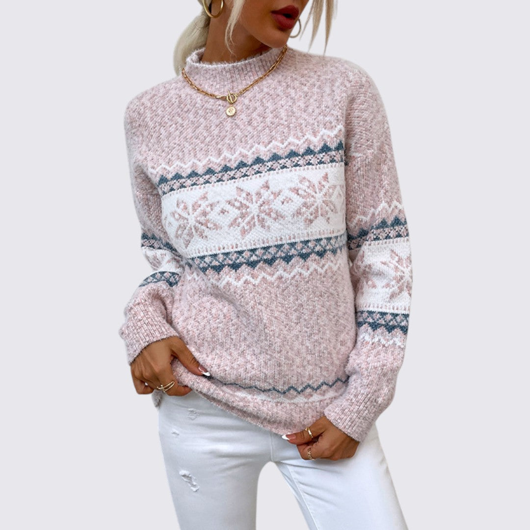 Pink marled mock neck sweater with white snowflake bands on the chest and sleeves