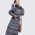 Grey longline quilted coat with fur trimmed hood, belted at the waist