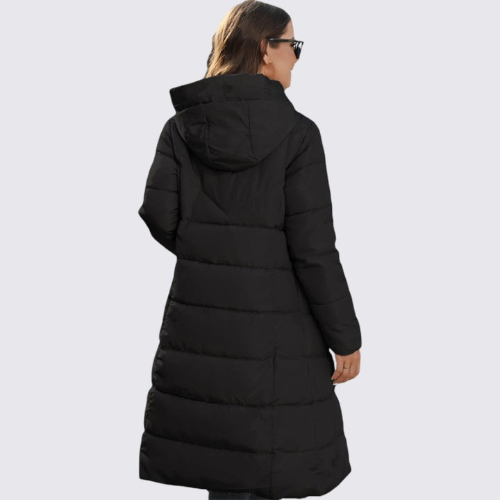 Back view of a long black hooded puffer coat