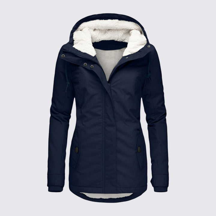 Navy hooded parka shown from the front with a cream fleece lined hood and collar