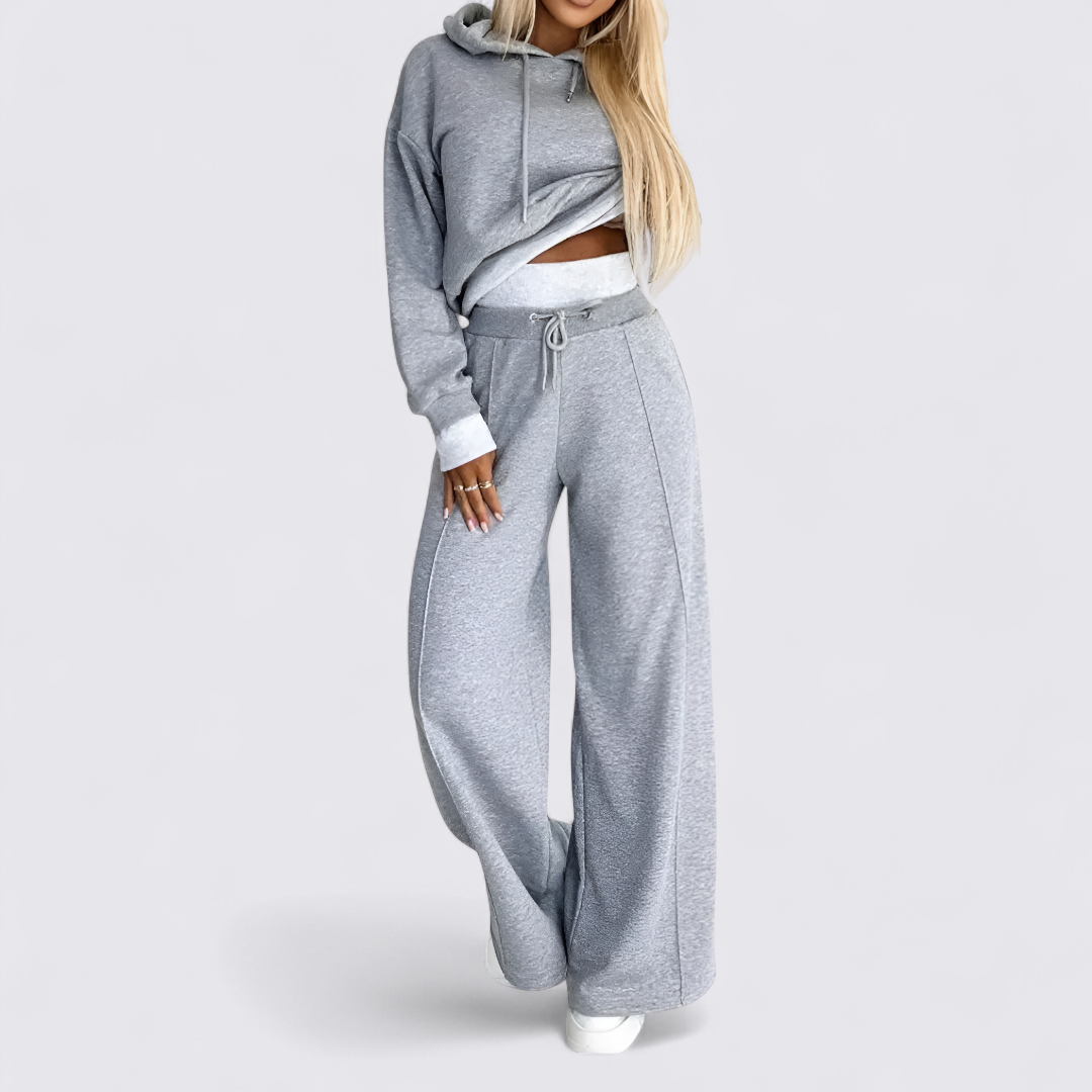 Grey two piece set with a cropped drawstring hoodie and high waisted wide leg sweatpants