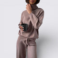 Mauve knit two piece set with mock neck top and wide leg pants, full front view