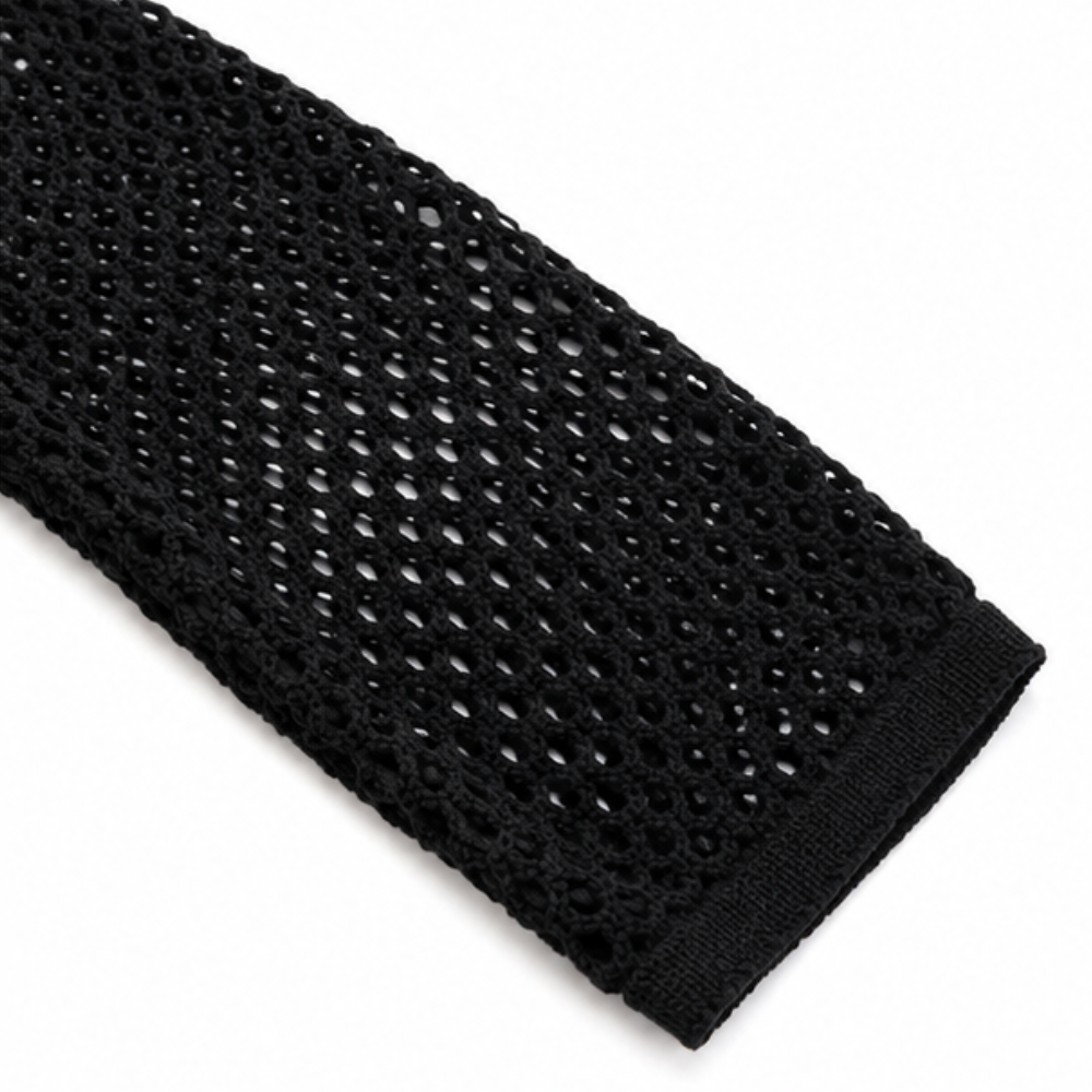 Close-up of the open mesh knit and ribbed cuff on a black hooded zip cardigan