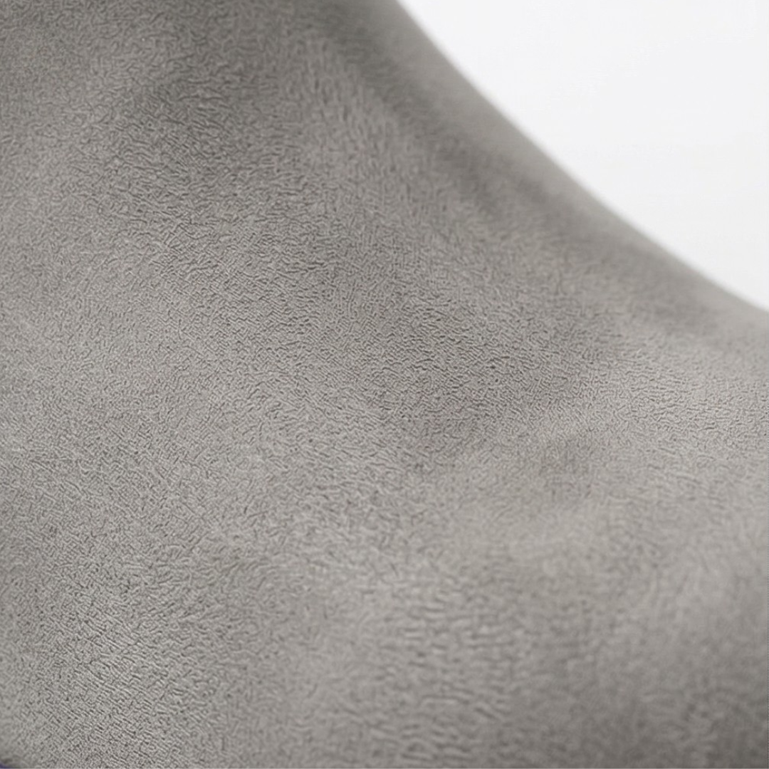 Close-up of the soft grey suede texture of the ankle boot upper