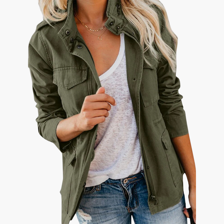 Army green zip front tailored jacket worn open over a white tee