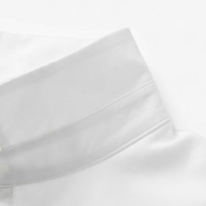 Close-up of the white blouse cuff with its stitched edge