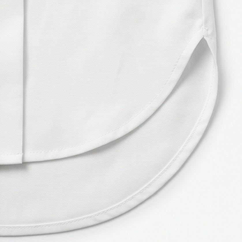 Close-up of the curved shirttail hem of the white blouse