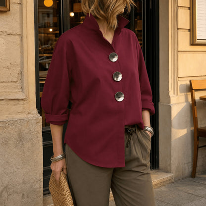Burgundy asymmetric button front blouse with oversized round buttons, front view