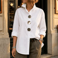 White asymmetric button front blouse with oversized round buttons, front view