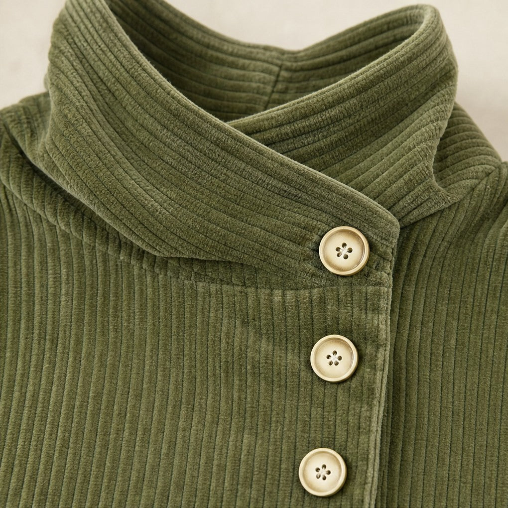 Close-up of the funnel collar and round buttons on the olive green corduroy top