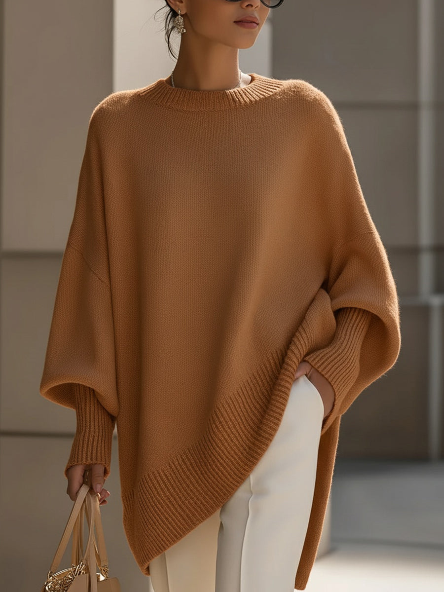 Caramel oversized poncho sweater with an asymmetric hem, front view