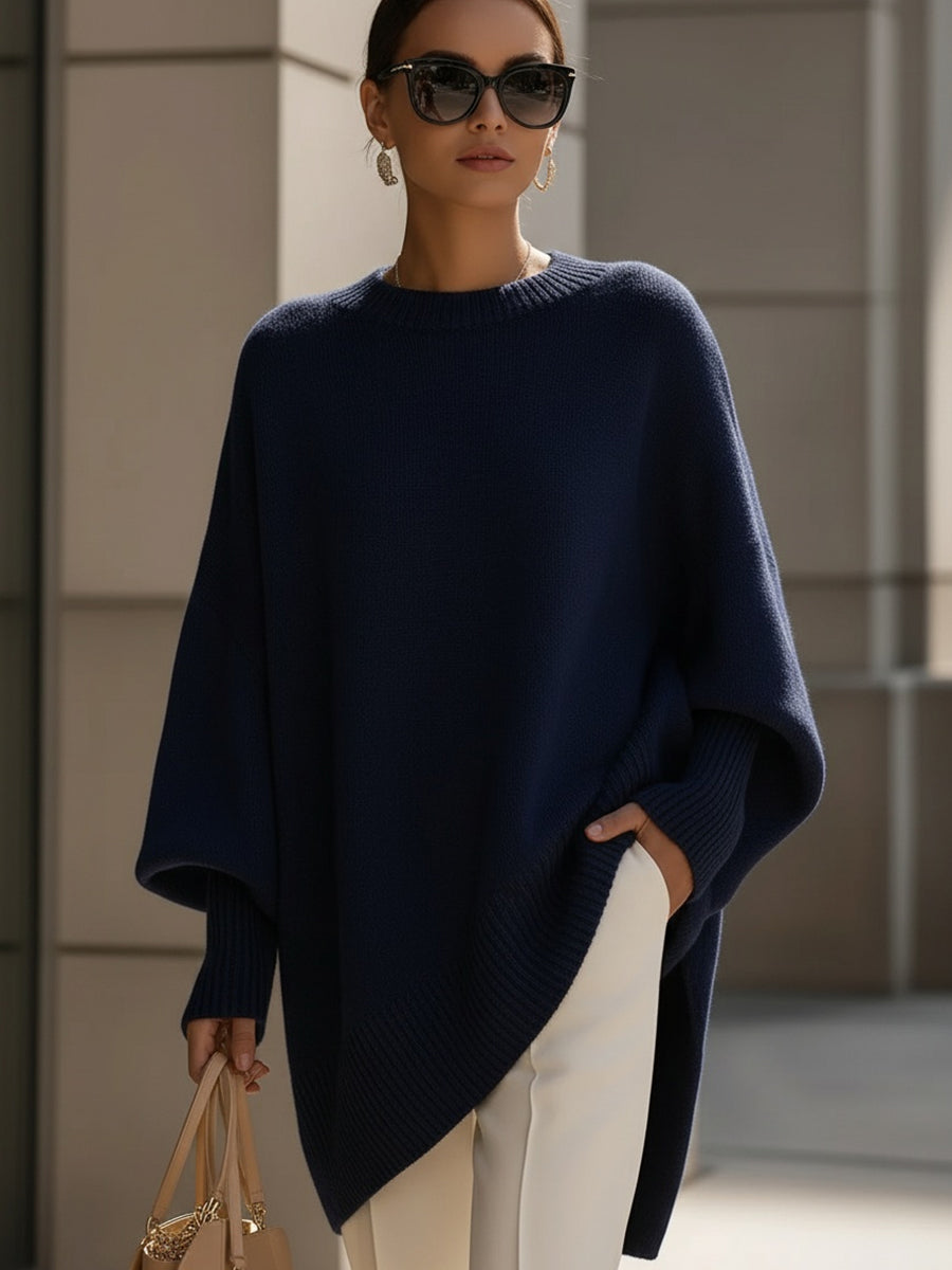 Navy oversized poncho sweater with an asymmetric hem, front view