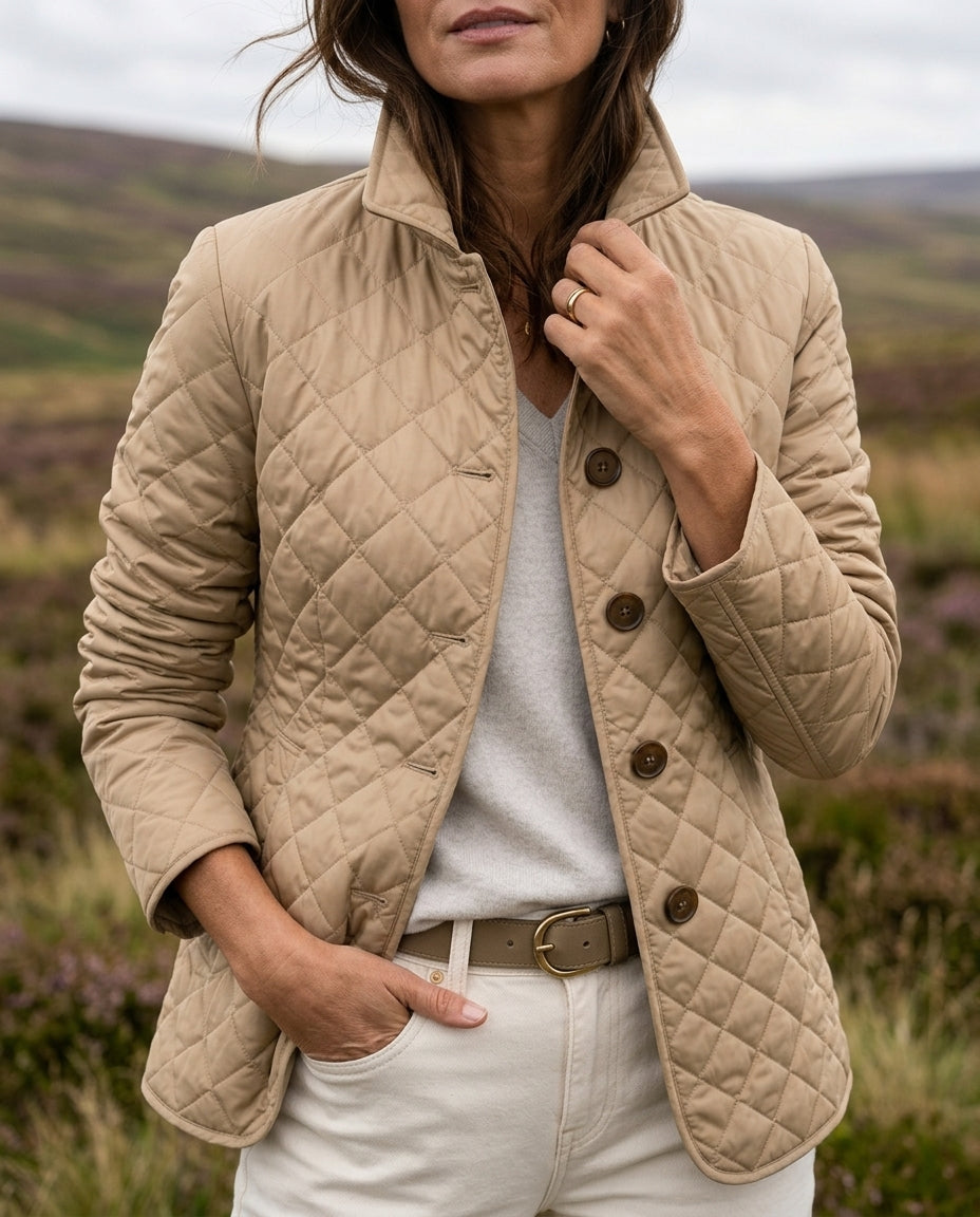 Beige diamond quilted jacket worn open over a white top