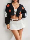 Black cropped cardigan with orange pumpkin and white ghost patches, open front