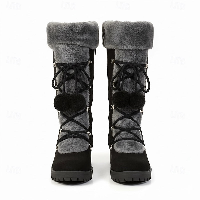 Pair of black fur cuff lace boots seen from the front