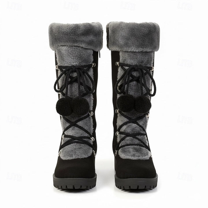 Pair of black fur cuff lace boots seen from the front