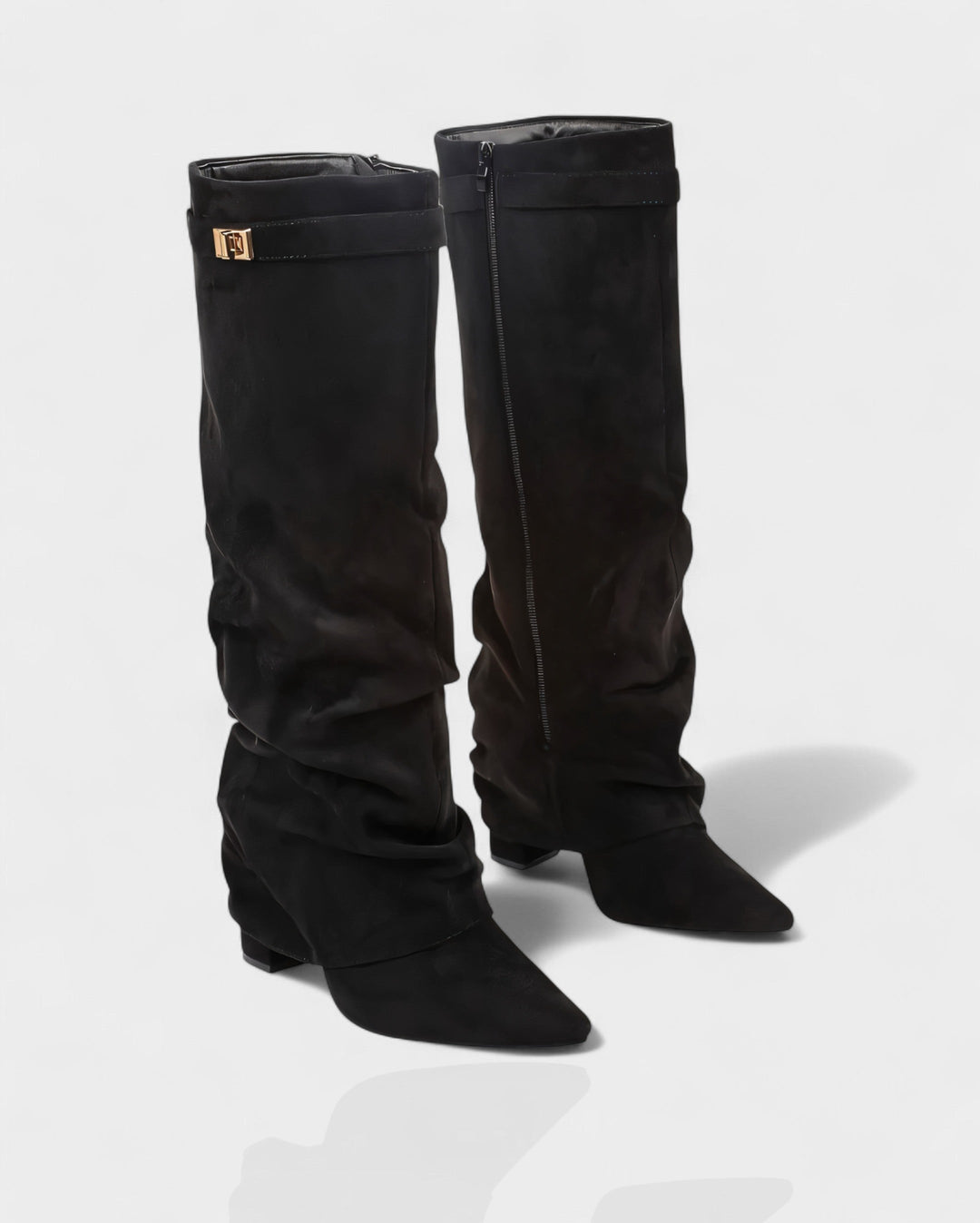 Pair of black suede foldover knee boots at a three quarter angle