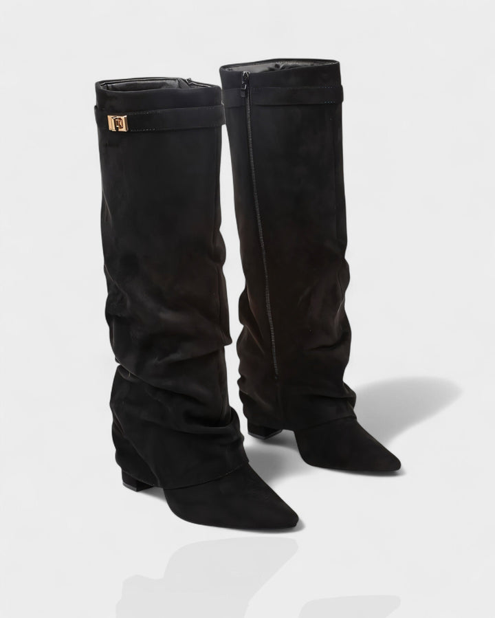 Pair of black suede foldover knee boots at a three quarter angle