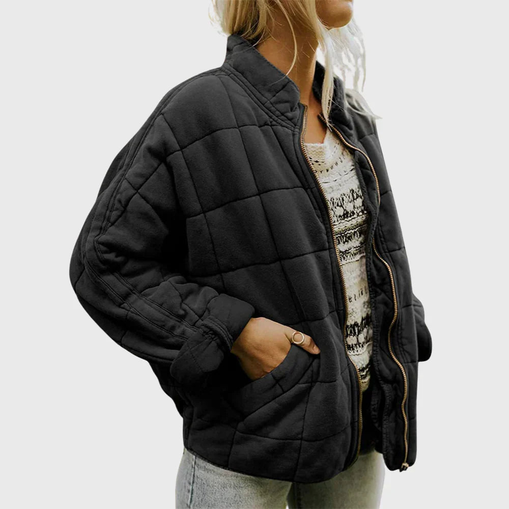 Black box quilted bomber jacket with slash pockets, front view