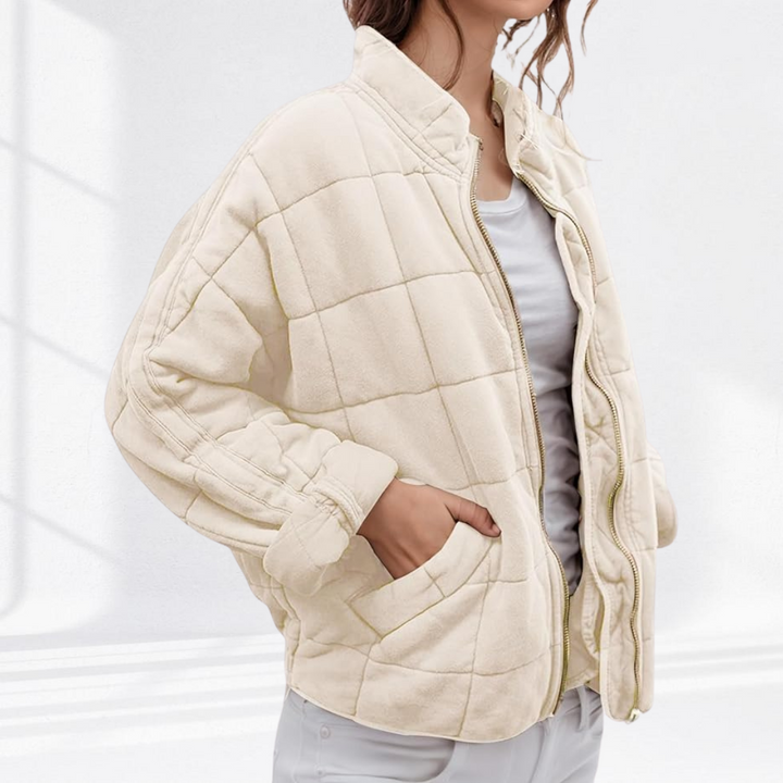 Cream box quilted bomber jacket with a stand collar, front view