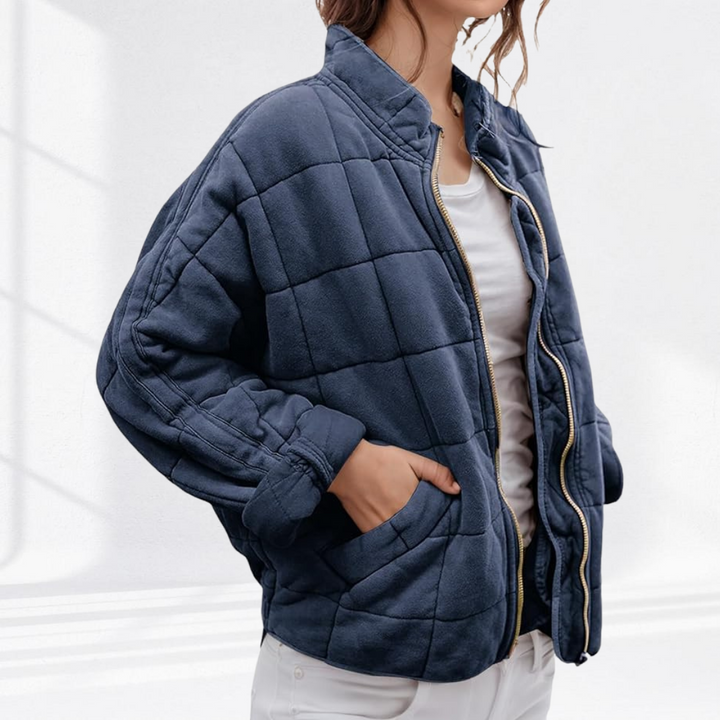 Navy box quilted bomber jacket with slash pockets, front view