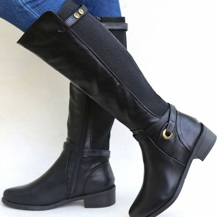 Black knee high boots with elastic back panel, ankle strap and low heel, side view