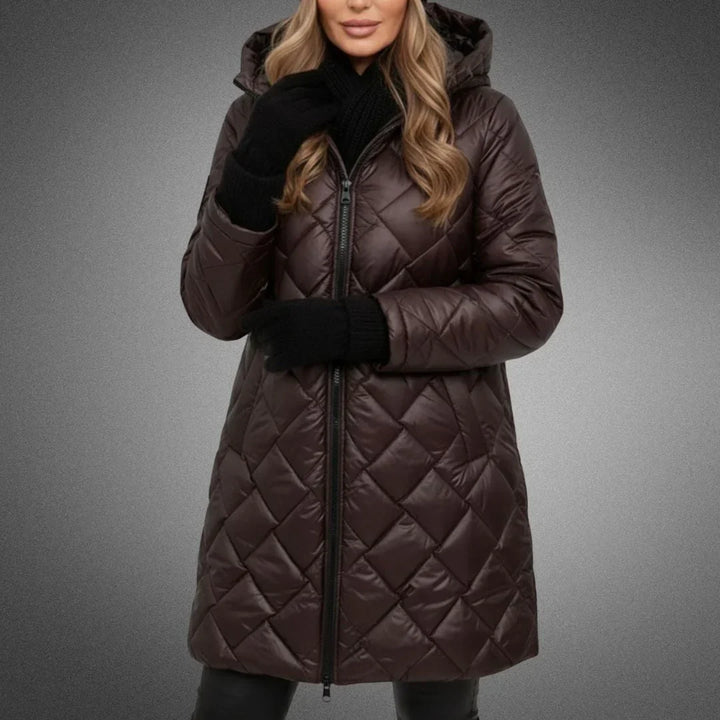 Brown diamond quilted longline coat worn zipped, front view