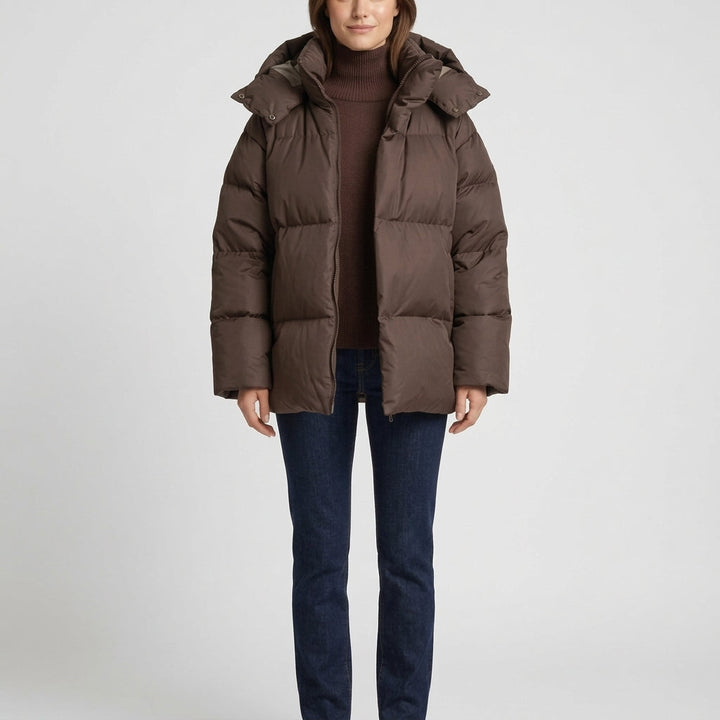 Brown oversized puffer coat with a wide hood, front view