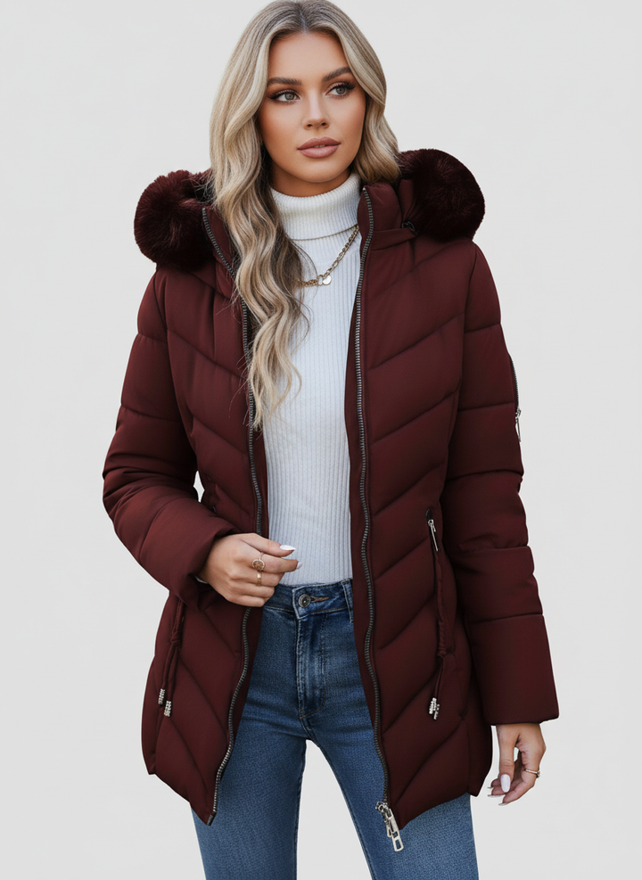 Burgundy quilted coat with a faux fur hood, worn open over jeans