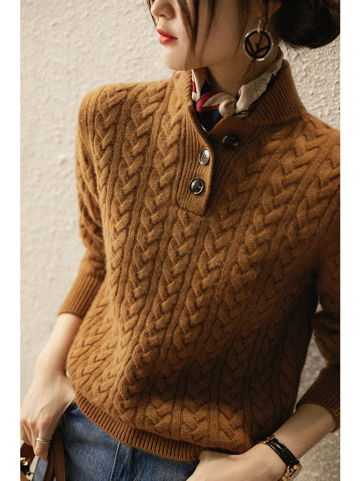 Caramel cable knit sweater with a stand collar, close view of the buttoned placket