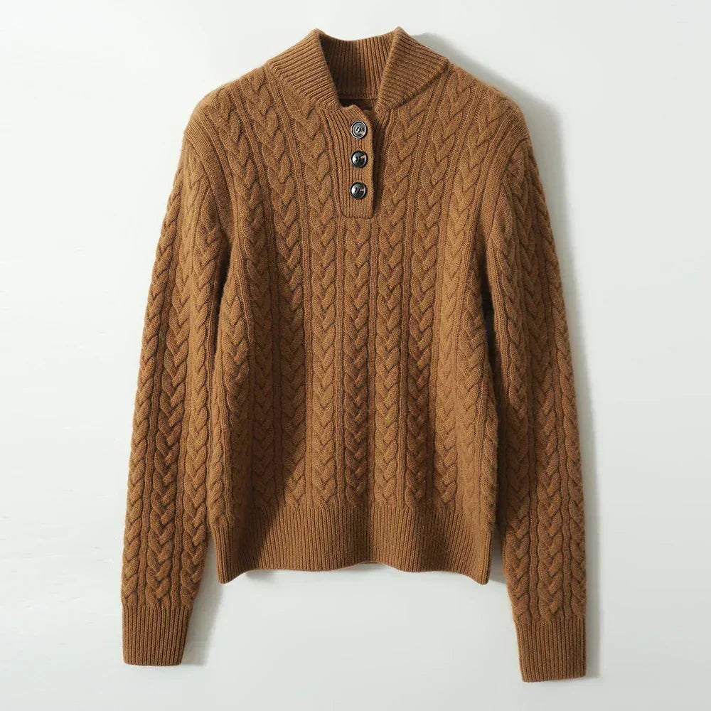 Caramel cable knit sweater with a stand collar, shown flat on a pale surface