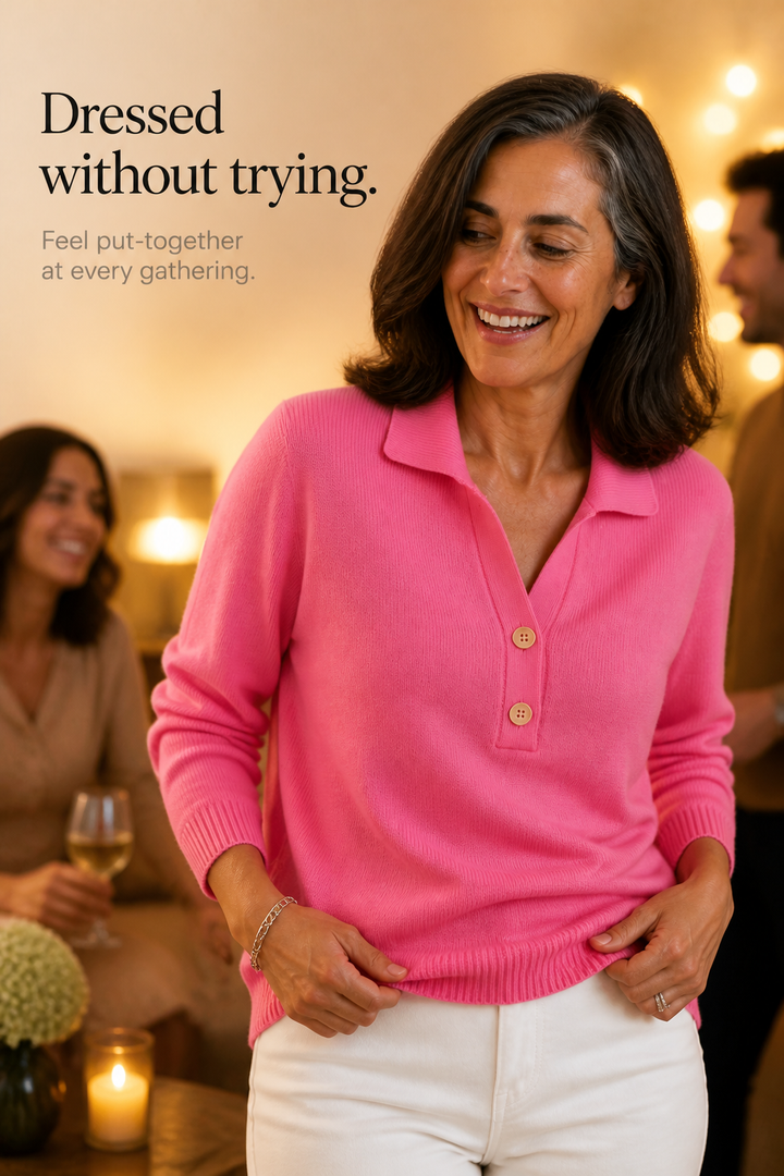 Woman wearing a bright pink polo collar sweater with wooden buttons at an evening gathering