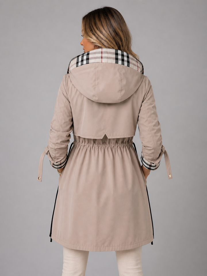 Back view of the beige hooded parka showing the drawcord waist