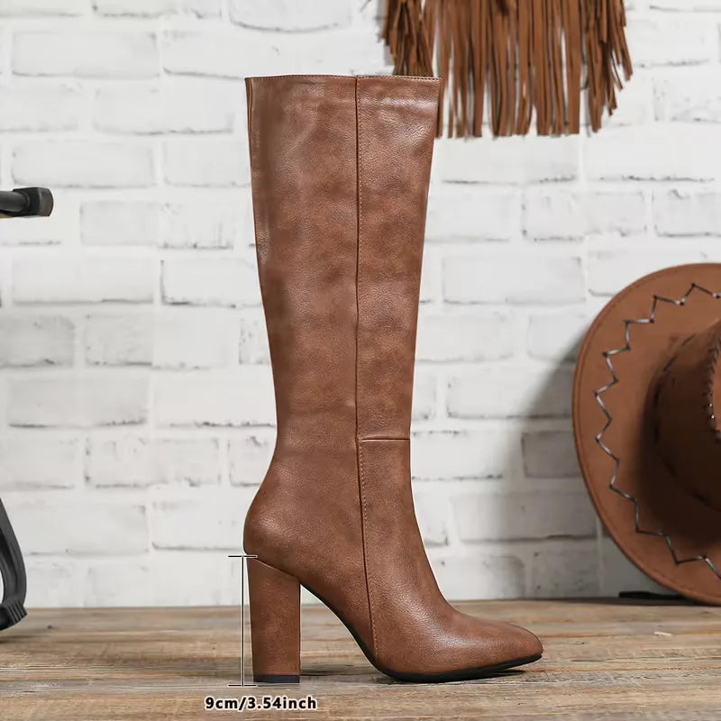 Brown chunky heel knee boot showing the heel height