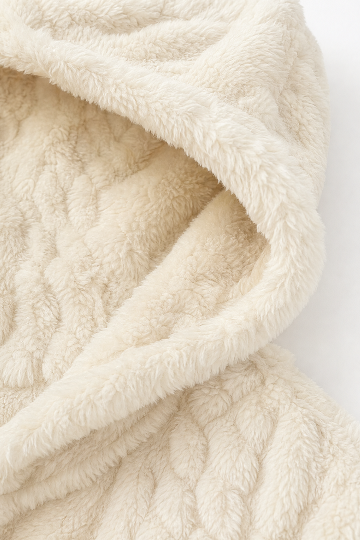 Soft cream fleece hood folded to show the plush pile