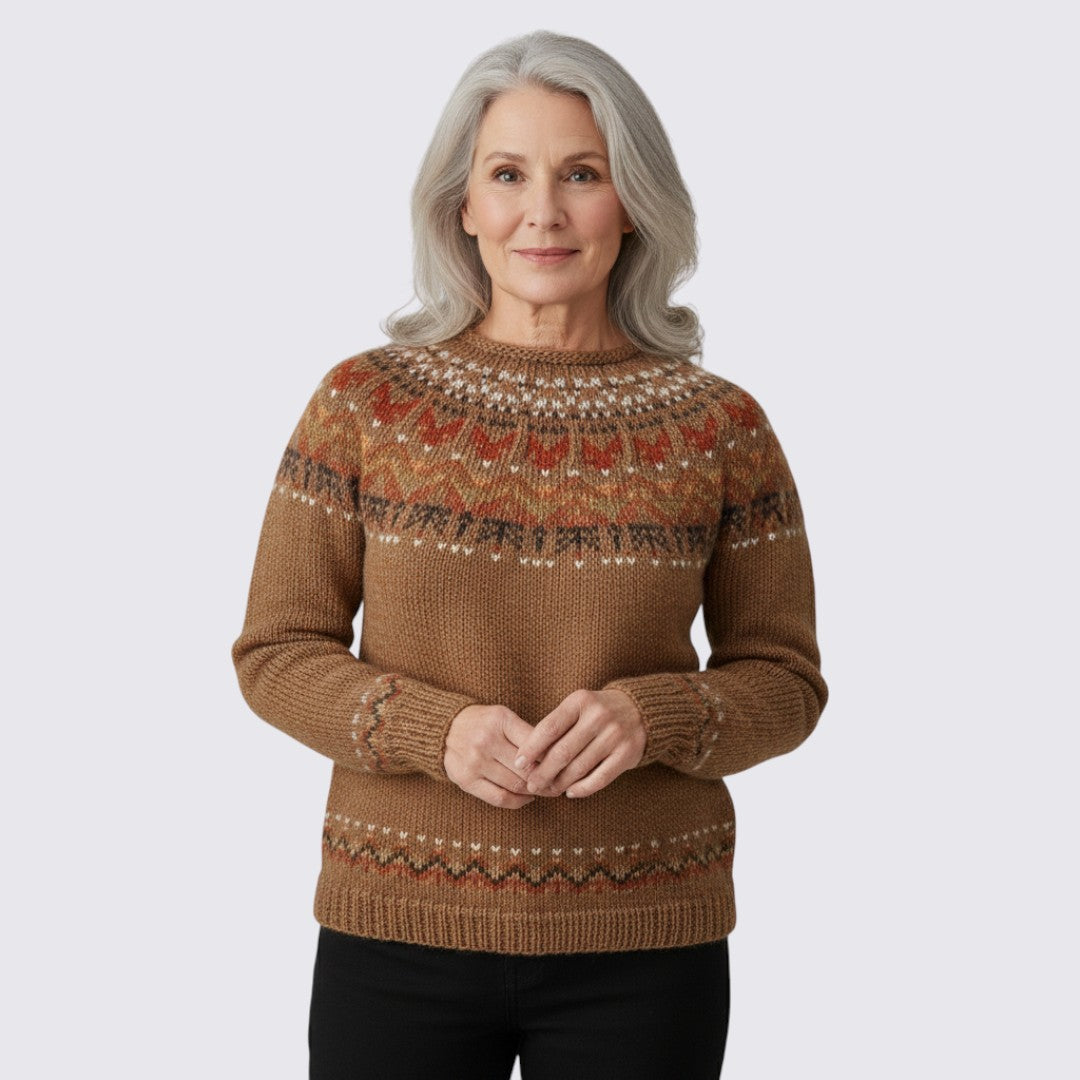 Camel crew neck sweater with a rust and cream patterned yoke, front view on a model
