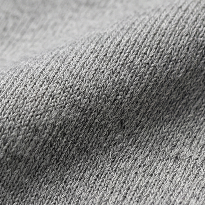 Close up of the soft grey knitted fabric of the longline hooded cardigan jacket