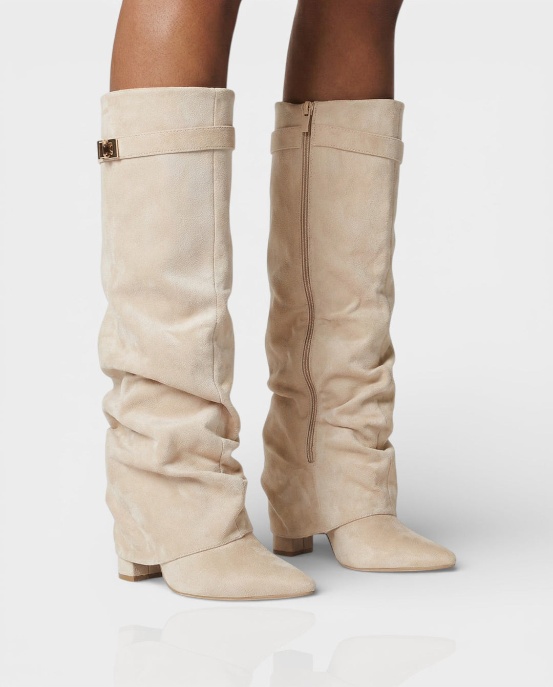 Cream suede foldover knee boots worn with bare legs, front angle