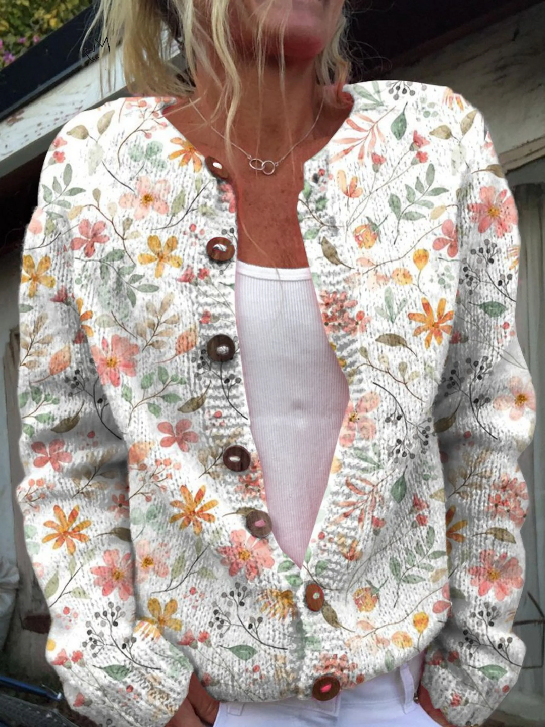Cream knit cardigan with orange and coral watercolour wildflower print and wooden buttons
