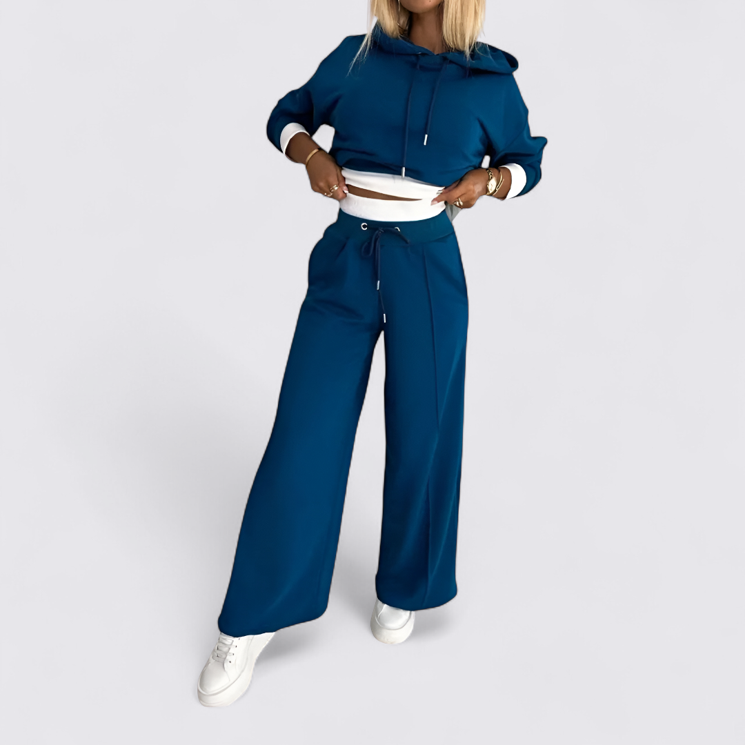 Teal cropped hoodie with matching wide leg trousers, worn with white trainers