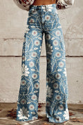 Blue wide leg pants printed with daisies on curling vines, front view