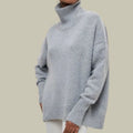 Light gray oversized turtleneck sweater with ribbed cuffs