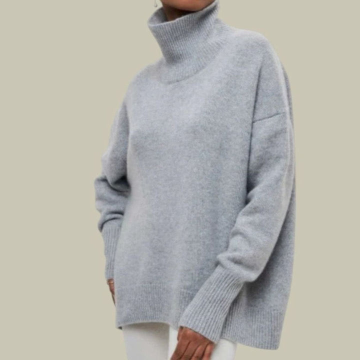 Light gray oversized turtleneck sweater with ribbed cuffs
