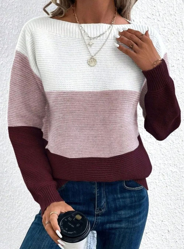 Color block knit sweater in white, dusty pink and burgundy, worn with jeans
