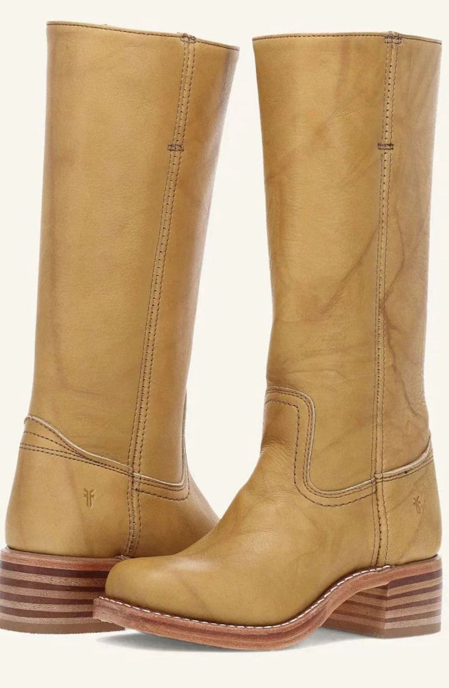 Pair of tan leather mid calf pull on boots with a stacked wooden heel, side view